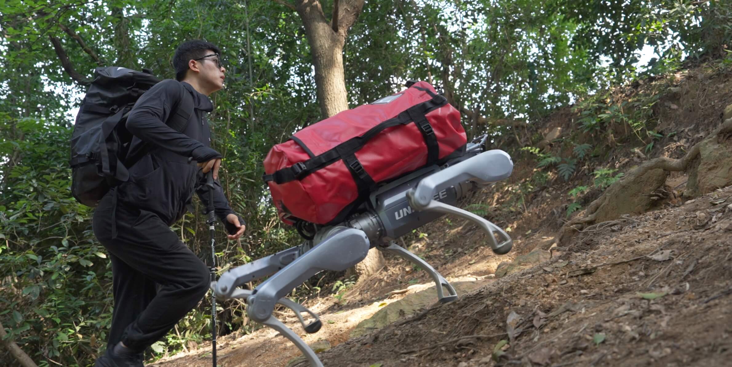 Person working alongside a robot in the field